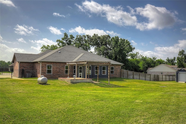 rear view of property with a lawn