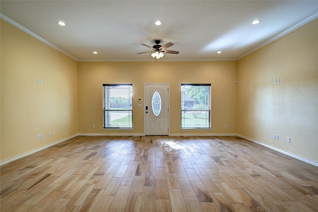 entryway with crown molding, ceiling fan, plenty of natural light, and light hardwood / wood-style flooring