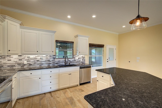 kitchen with stainless steel appliances, sink, and white cabinets