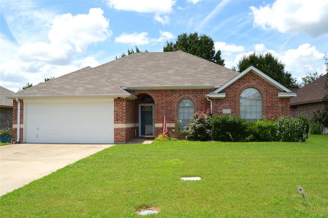 single story home featuring a garage and a front lawn