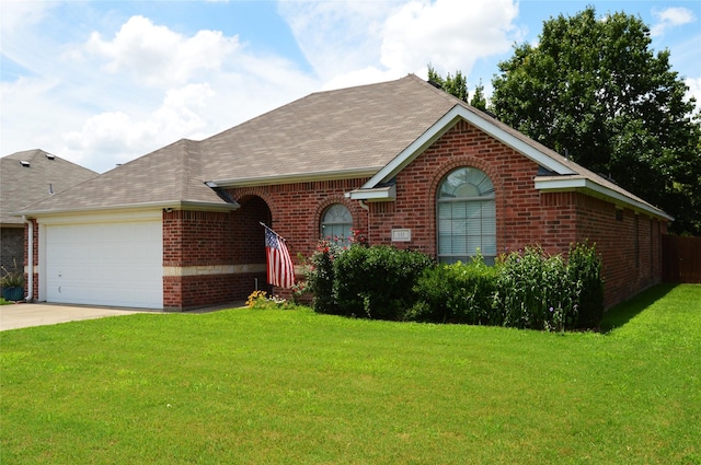 single story home featuring a garage and a front lawn