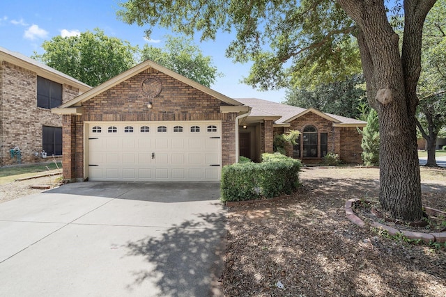 ranch-style home featuring a garage