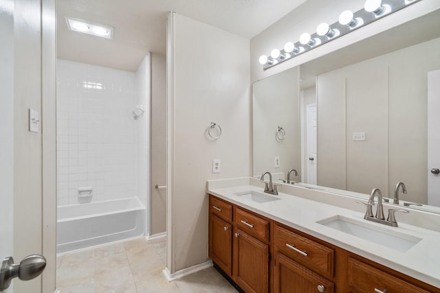 bathroom featuring tile patterned flooring, vanity, and tiled shower / bath combo