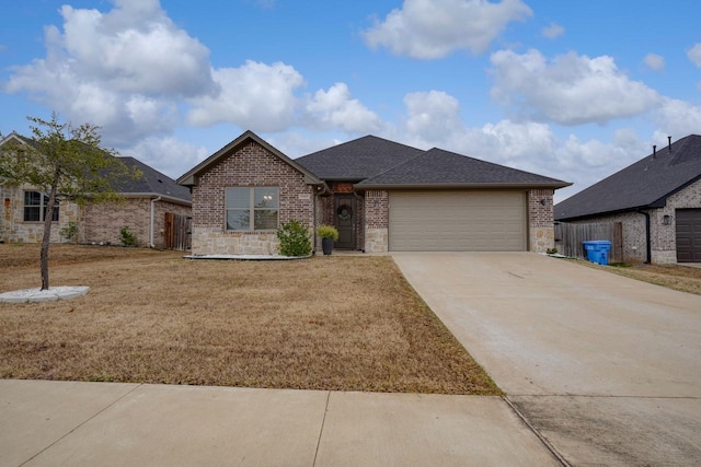 view of front of property with a garage and a front yard