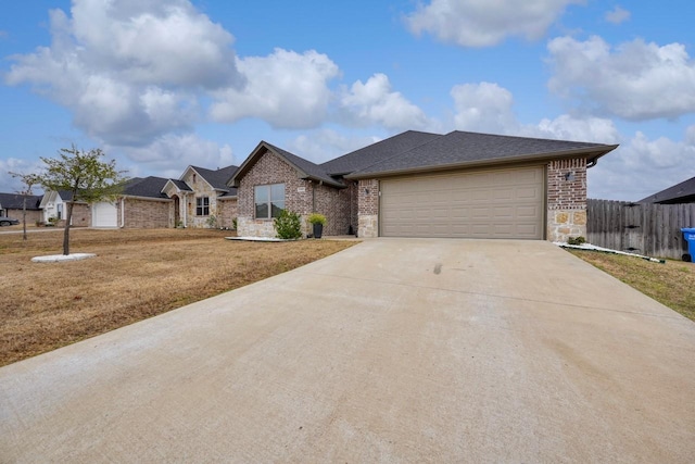 view of front of property with a garage and a front lawn