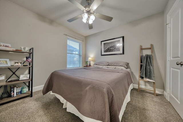 bedroom with ceiling fan and dark carpet