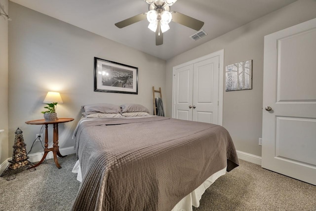 carpeted bedroom with a closet and ceiling fan