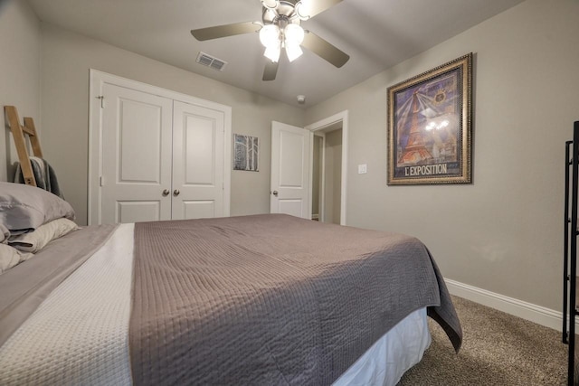 carpeted bedroom with ceiling fan and a closet