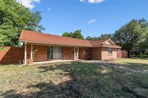 ranch-style home with a front lawn