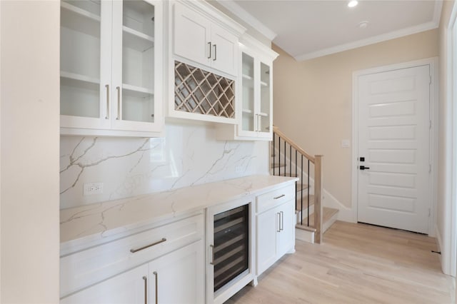 121 Ford Ct, Weston, TX 75009 - indoor dry bar with beverage cooler, tasteful backsplash, light wood-style floors, crown molding, and recessed lighting