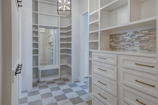 121 Ford Ct, Weston, TX 75009 - walk in closet featuring a chandelier