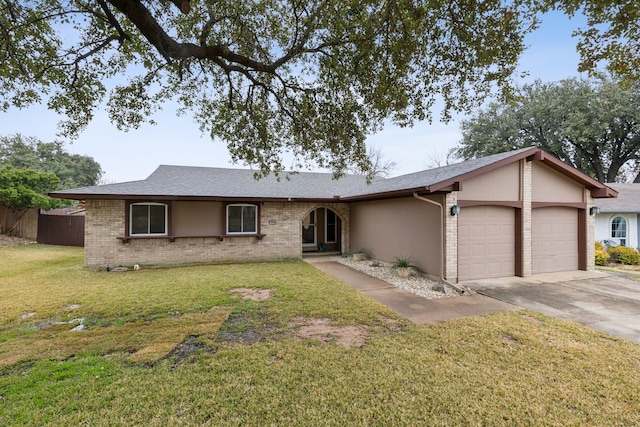 ranch-style house with a garage and a front yard