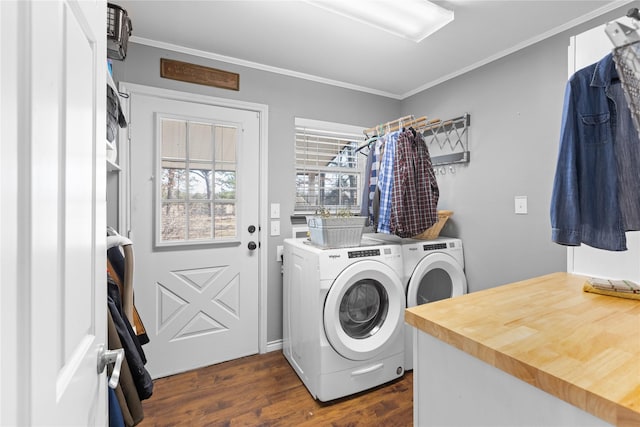 washroom featuring ornamental molding, separate washer and dryer, and dark hardwood / wood-style floors