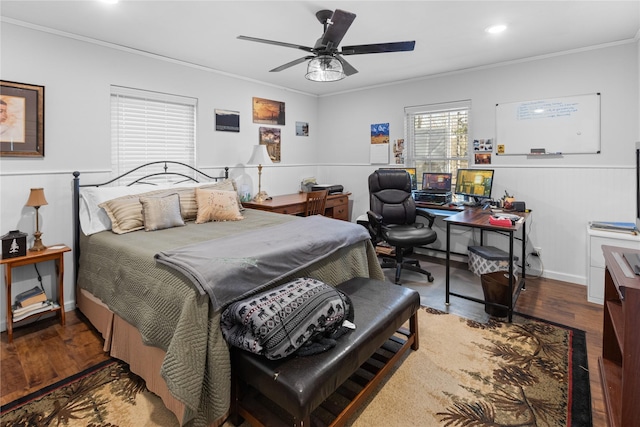 bedroom with hardwood / wood-style flooring, ornamental molding, and ceiling fan