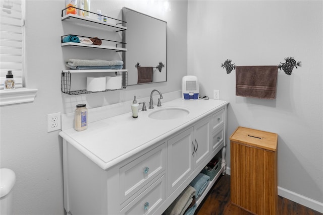 bathroom featuring vanity and hardwood / wood-style flooring