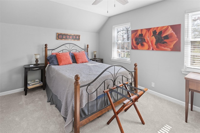 carpeted bedroom featuring lofted ceiling and ceiling fan