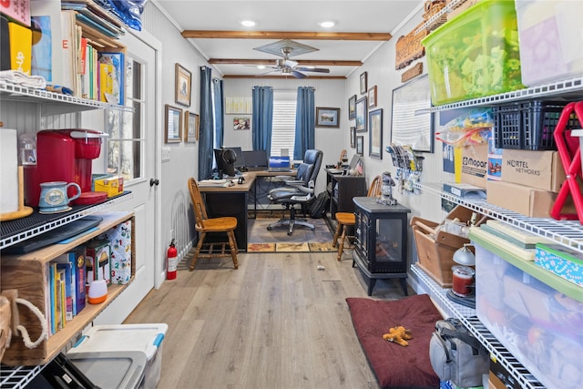 office space featuring beam ceiling, light hardwood / wood-style floors, and ceiling fan