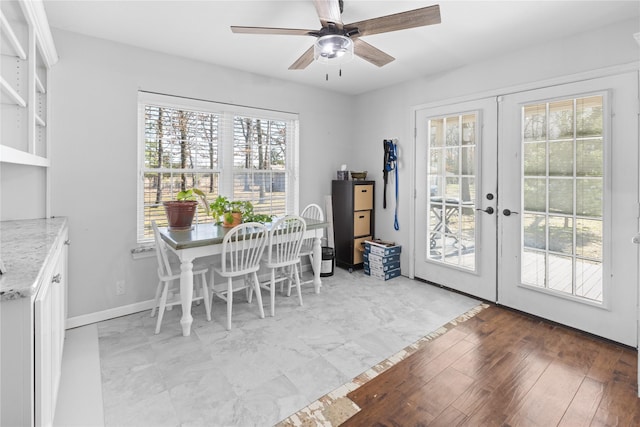 dining area featuring french doors, ceiling fan, and light wood-type flooring