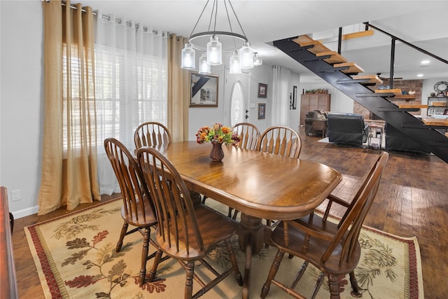 dining area with dark hardwood / wood-style floors