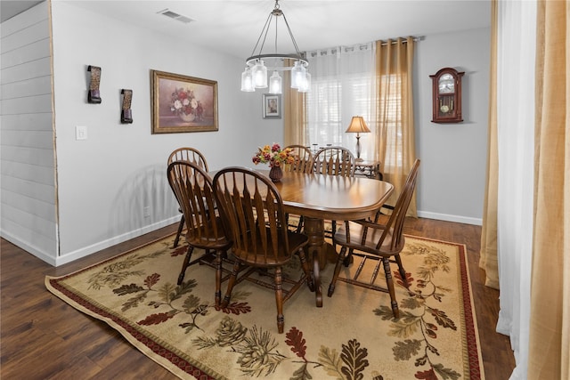 dining space featuring dark wood-type flooring