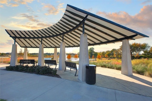 surrounding community with a gazebo and a water view