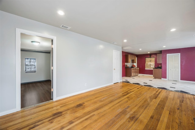 unfurnished living room with hardwood / wood-style floors