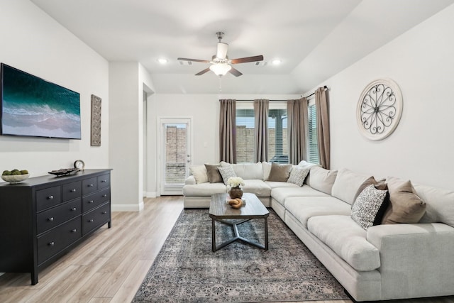 living room featuring light wood finished floors, recessed lighting, a ceiling fan, and baseboards