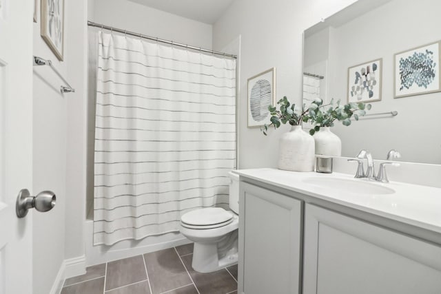 bathroom with toilet, tile patterned flooring, shower / bath combo with shower curtain, and vanity