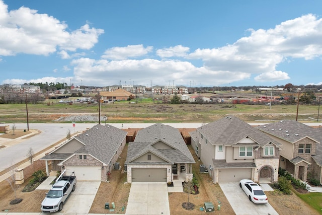 birds eye view of property with a residential view