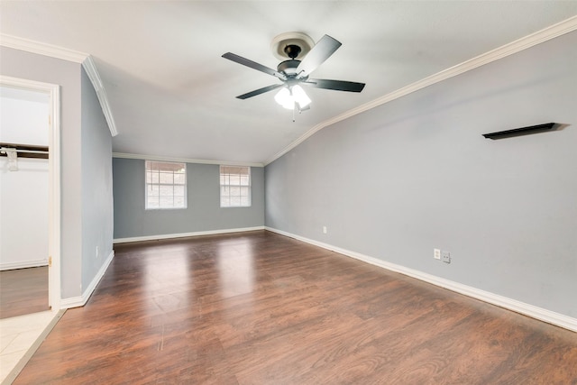 empty room featuring dark wood-style floors, ceiling fan, and crown molding