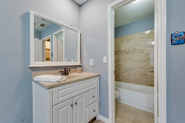 full bath with shower / bath combination, visible vents, toilet, tile patterned floors, and vanity