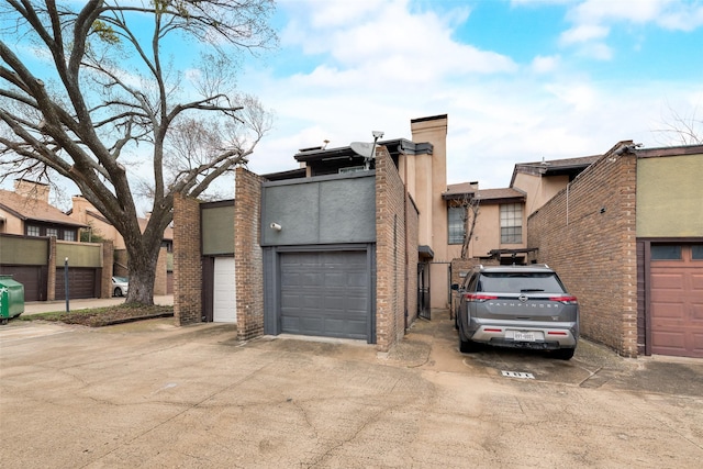 view of front facade featuring a residential view and stucco siding