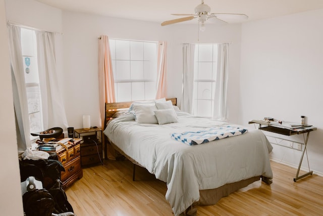 bedroom featuring a ceiling fan and light wood-style floors