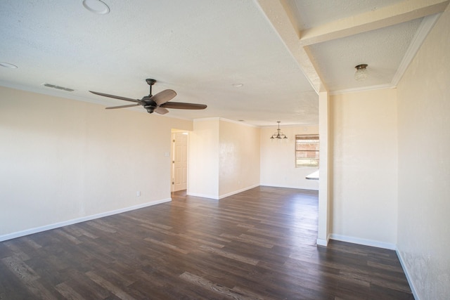 spare room with dark wood-style floors, ornamental molding, a textured ceiling, baseboards, and ceiling fan with notable chandelier