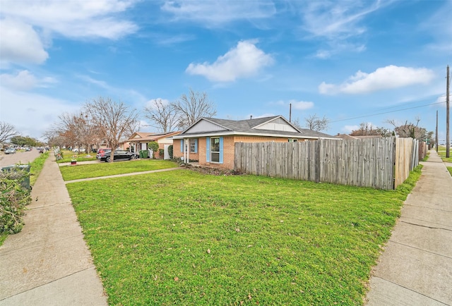 view of side of property featuring a lawn