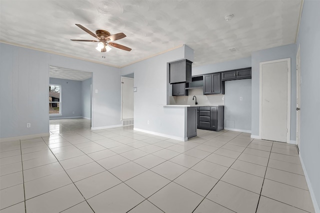 kitchen featuring sink, gray cabinets, ceiling fan, and light tile patterned flooring