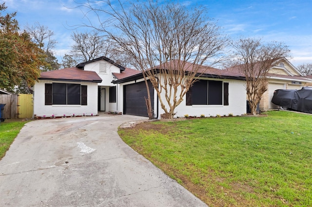 ranch-style house with a garage and a front yard