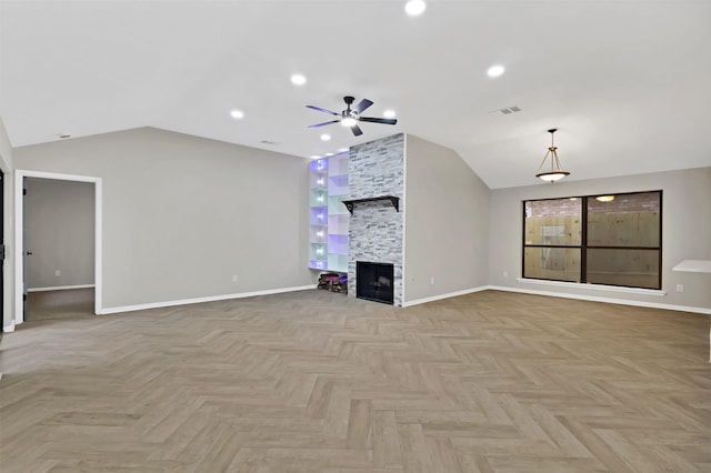 unfurnished living room with ceiling fan, lofted ceiling, light parquet flooring, and a fireplace