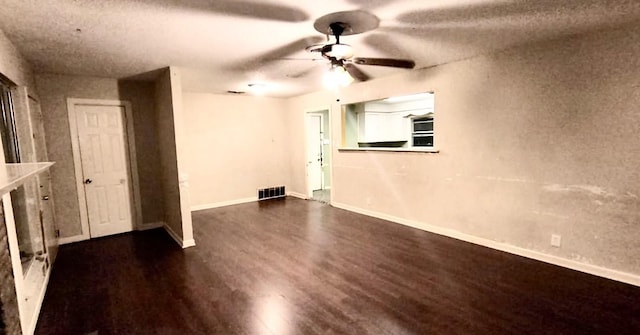 unfurnished room with dark hardwood / wood-style floors and ceiling fan