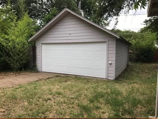 garage with a yard