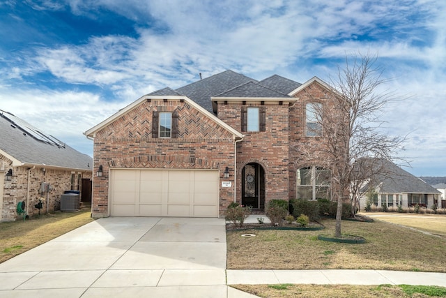 traditional-style house featuring a garage, central AC, brick siding, and driveway