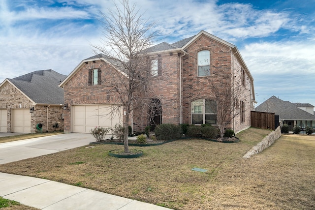 traditional home featuring a garage, concrete driveway, brick siding, and a front lawn