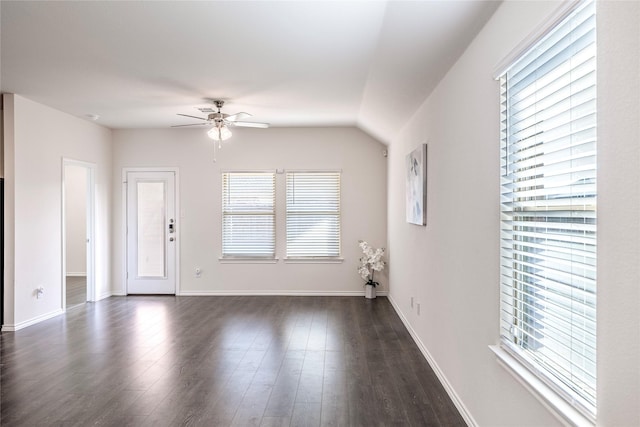 interior space with dark wood-type flooring and ceiling fan