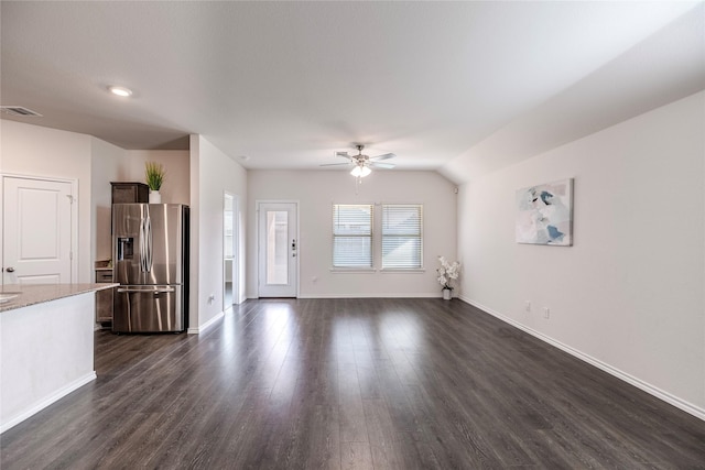 unfurnished living room with lofted ceiling, dark hardwood / wood-style floors, and ceiling fan