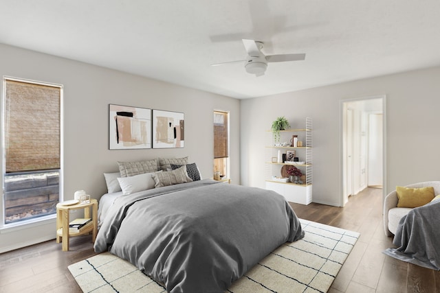 bedroom featuring hardwood / wood-style floors and ceiling fan