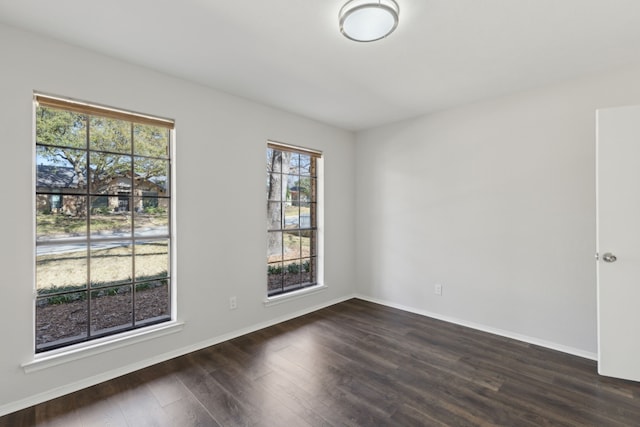 spare room featuring dark hardwood / wood-style floors