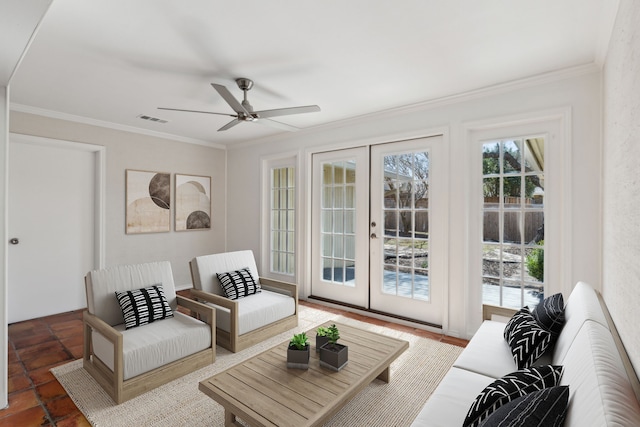 living room with crown molding, french doors, and ceiling fan