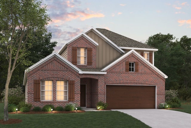 view of property with a garage and a yard