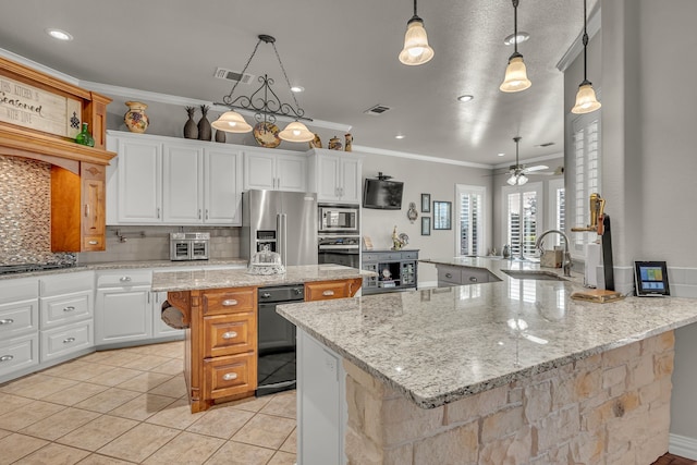 kitchen with pendant lighting, sink, white cabinetry, stainless steel appliances, and kitchen peninsula