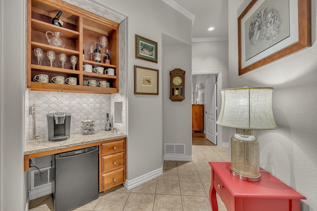 bar with crown molding, backsplash, fridge, light stone countertops, and light tile patterned flooring